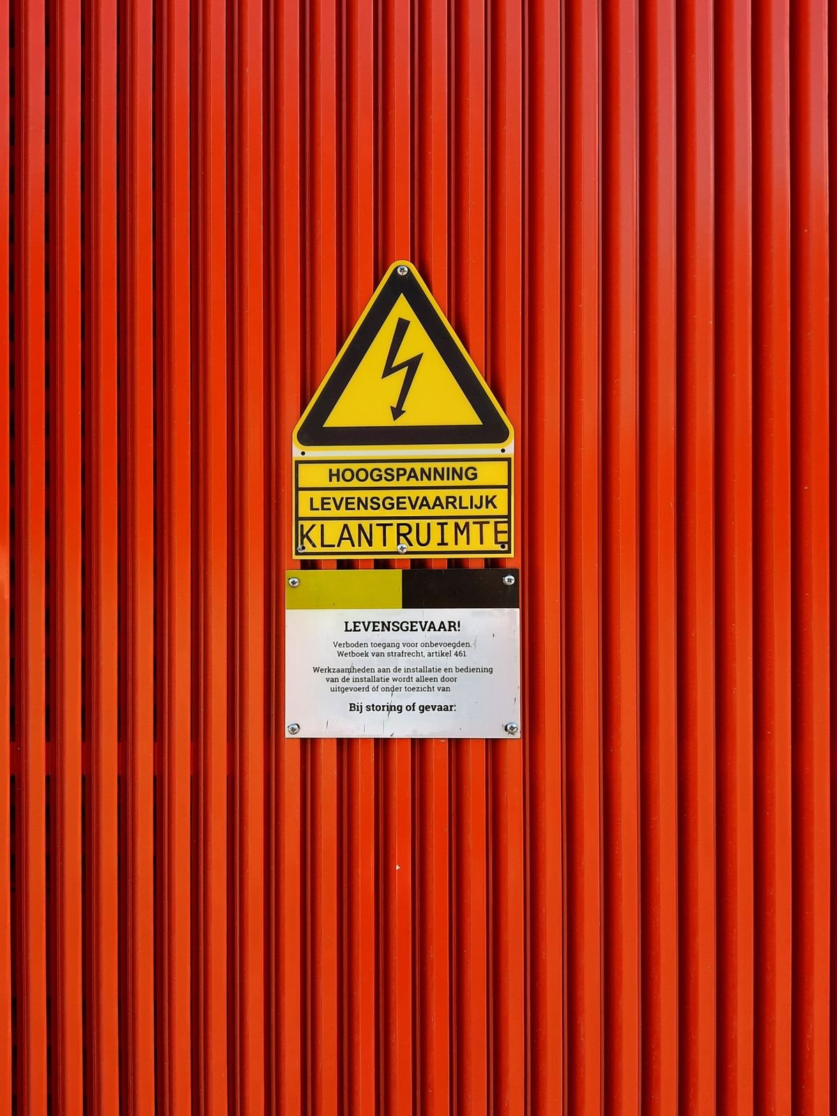 High voltage style warning sign on a red background