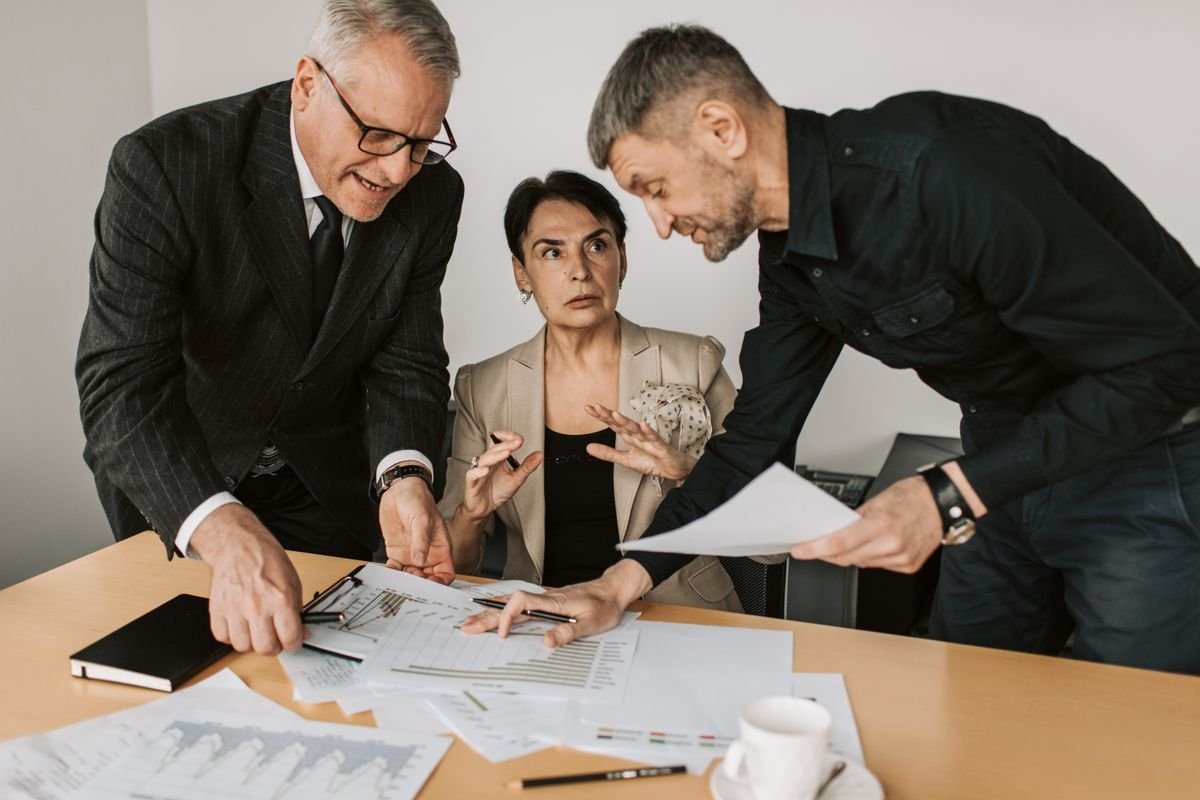 Team reviewing evidence documents and reports at a table